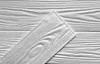 A close-up view of white wood-textured panels, with one panel angled diagonally over others. Anteprima dell’immagine prodotto