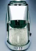 A chrome-plated ice crusher with a clear glass container filled with crushed ice. Náhled obrázku produktu