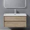 A modern wall-mounted bathroom vanity with a sink and faucet, against a grey wall. Anteprima dell’immagine prodotto