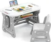 A child's desk and chair set with various art supplies and books. Produktbild-Vorschau