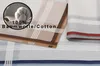 Close-up view of folded handkerchiefs with a circular inset showing cotton. Produktbild-Vorschau
