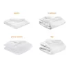 A collage of four folded duvets, each labeled with a different warmth level. Produktbild-Vorschau