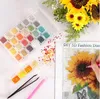 A diamond painting kit with various colored beads and tools, along with a partially completed sunflower painting. Náhľad obrázku produktu