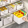 A collection of white storage bins filled with various food items and bottles, neatly arranged on shelves. Produktbild-Vorschau
