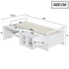 A white wooden bed frame with integrated desk and storage shelves, shown with dimensions marked. Produktbild-Vorschau