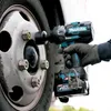 A person's hand wearing a glove is using a cordless impact wrench to tighten the lug nuts on a truck wheel. Produktbild-Vorschau