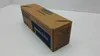 A cardboard box with blue lettering on a white and light gray surface. Anteprima dell’immagine prodotto