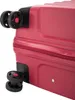 Close-up view of the wheels and zipper of a red suitcase. Náhľad obrázku produktu