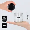 A hand holds a black lid over a glass jar, while another hand supports the jar, with measurement indicators shown. Anteprima dell’immagine prodotto
