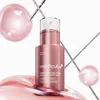 A product shot of a pink serum bottle with decorative elements. Produktbild-Vorschau