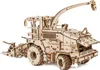 A wooden model of a harvesting machine is displayed against a white background. Podgląd zdjęcia produktu
