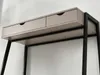 A close-up view of the top section of a desk, showing two drawers and the black metal frame. Anteprima dell’immagine prodotto