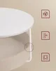 Close-up of a white round table with a beige fabric basket underneath. Náhled obrázku produktu