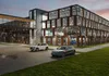 A modern multi-story parking garage with cars parked inside and outside. Voir les images du produit