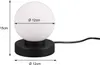 A black table lamp with a white spherical glass shade, shown with dimensions indicated. Produktbild-Vorschau