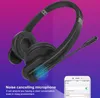 A pair of black headphones with a microphone is shown against a gradient background of purple and blue. A smartphone displaying a connection interface is also visible. Náhľad obrázku produktu