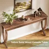 A wooden console table with decorative items and a painting on the wall. Anteprima dell’immagine prodotto