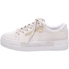 A side view of a beige sneaker with a platform sole and gold zipper detail. Náhled obrázku produktu