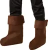 Close-up of a person's legs wearing brown boot covers over black pants. Produktbild-Vorschau
