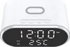 A white digital alarm clock with a black display showing the time and temperature. Produktbild-Vorschau