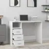 A white desk with drawers and a laptop on it, set in a room with artwork on the wall and shelves. Produktbild-Vorschau