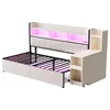 A white and black metal bed frame with storage drawers and shelves, illuminated by pink LED lights. Podgląd zdjęcia produktu