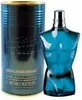 A bottle of Jean Paul Gaultier Le Male Eau de Toilette and its cylindrical packaging. Voir les images du produit