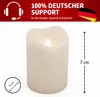 A cream-colored LED candle with a flame, shown with size indicators. Produktbild-Vorschau
