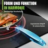 A close-up shot of a frying pan with salmon cooking on an induction stovetop, with a focus on the pan's handle. Produktbild-Vorschau