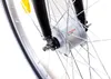 A close-up view of a bicycle's front wheel hub and fork. Produktbild-Vorschau