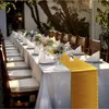 A long table set for a formal event, outdoors, with chairs and place settings. Anteprima dell’immagine prodotto