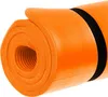 A rolled-up orange yoga mat with a black strap. Podgląd zdjęcia produktu