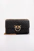 A black quilted handbag with gold hardware is displayed against a white background. Voir les images du produit