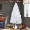 A white artificial Christmas tree is set up in a living room with a couch and gifts. Podgląd zdjęcia produktu