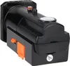 A close-up product shot of a black device with orange switches. The device has a textured top and a small red and silver detail. Produktbild-Vorschau