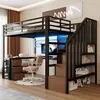 A loft bed with a desk and storage stairs in a bedroom setting. Voir les images du produit