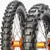 Close-up shot of two motorcycle tires with orange hubs and spokes. Náhled obrázku produktu