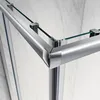A close-up view of the corner of a glass shower enclosure with chrome metal framing. Produktbild-Vorschau