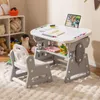 A child's desk and chair set in a room with shelves and toys. Produktbild-Vorschau