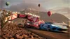 A racing game scene with cars, hot air balloons, and a festival-like archway. Produktbild-Vorschau