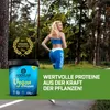 A woman is running in a forest, with a product container and a laurel wreath award in the foreground. Produktbild-Vorschau