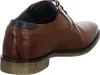 A close-up side view of a brown leather shoe. Produktbild-Vorschau