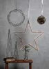 Various Christmas-themed light decorations are displayed against a gray wall. Podgląd zdjęcia produktu