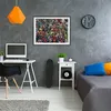 A bedroom or study area with a desk, bed, and wall art. Náhled obrázku produktu