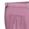 A close-up view of the top corner of a pink travel crib. Anteprima dell’immagine prodotto