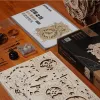 A collection of wooden puzzle pieces, instructions, and components for a mechanical clock, laid out on a wooden surface. Produktbild-Vorschau