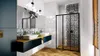 A modern bathroom with a vanity, sinks, and a shower enclosure. Anteprima dell’immagine prodotto