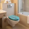 A modern bathroom with a toilet and bathtub. Produktbild-Vorschau