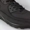 A close-up view of a black sneaker. Produktbild-Vorschau