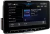 A close-up view of an Alpine car stereo system's touchscreen display, showing the radio interface with station lists and playback information. Podgląd zdjęcia produktu